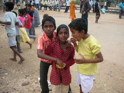 Children are eating from one plate