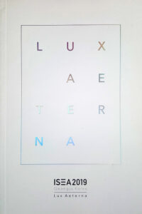 Book cover colorful letters: LUX AETERNA on white background